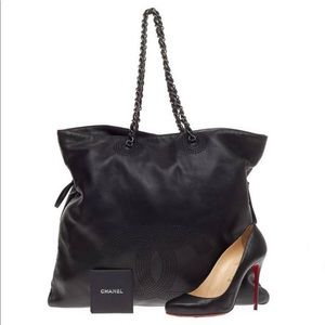 This authentic Chanel Bon Bon Tote Studded Leather